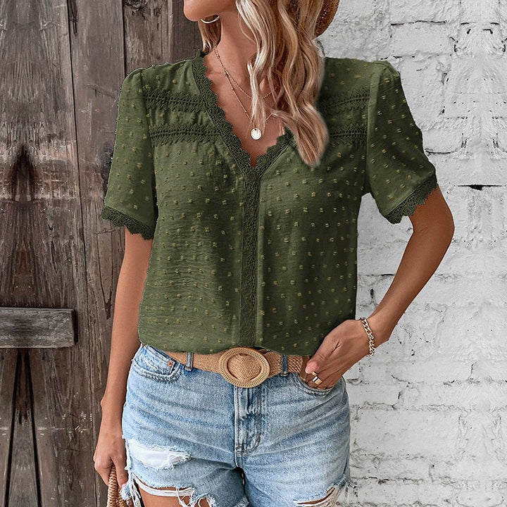 Front view of a women's V-neck Swiss Dot top, showcasing the delicate lace trim and feminine short sleeves.