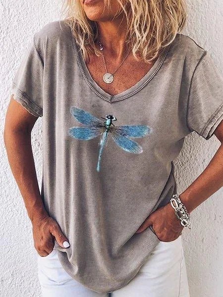 Relaxed fit women's V-neck tee with detailed dragonfly print. Comfortable short sleeve top for everyday casual wear.
