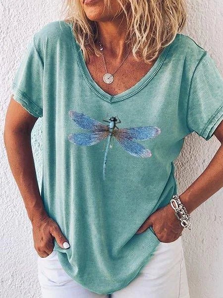 Green women's V-neck tee with an elegant dragonfly print. A chic, comfortable short sleeve top for spring fashion.