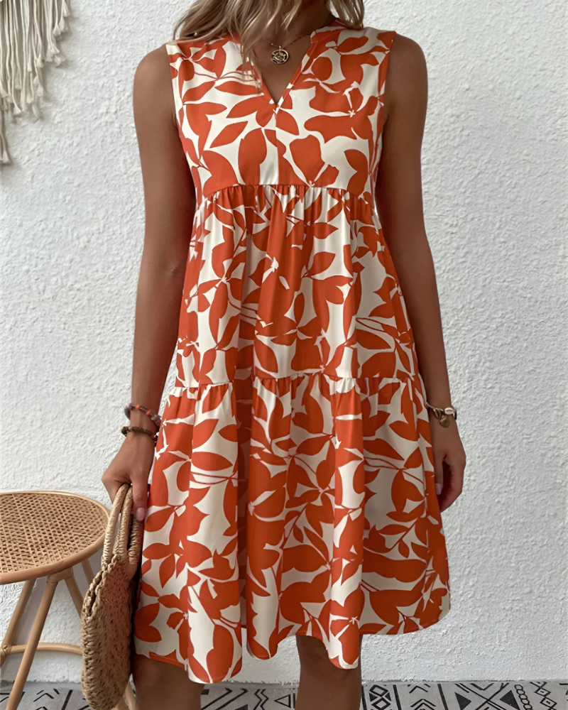 Relaxed fit women's V-neck tiered midi dress, versatile for casual spring fashion or elegant summer outings.