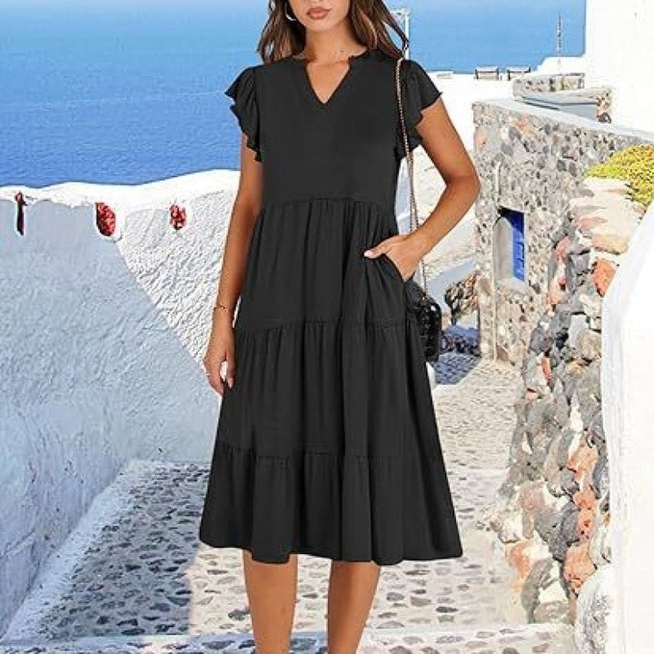 Casual yet elegant V-neck tiered midi dress for women, featuring chic flutter sleeves.