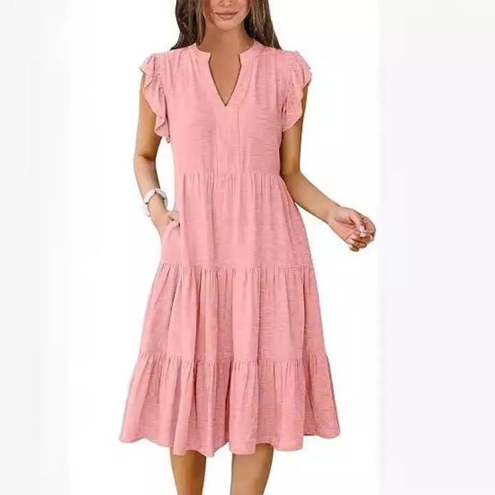 Comfortable women's V-neck tiered midi dress with flutter sleeves, ideal for everyday wear.
