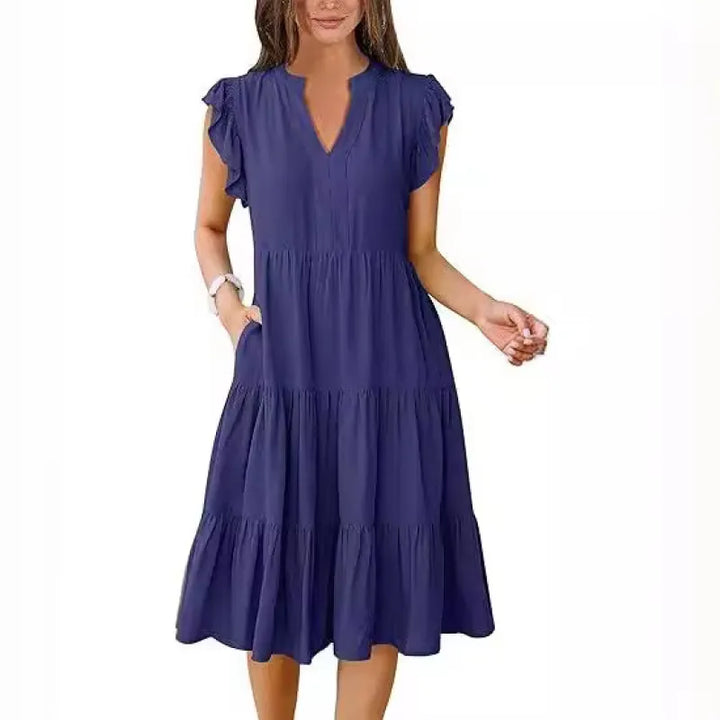 Stylish women's midi dress, V-neck, tiered skirt, and flutter sleeves. Great for summer fashion.