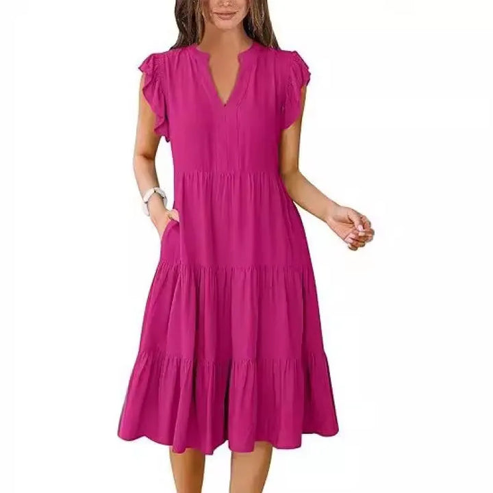 Flowy women's V-neck tiered midi dress with delicate flutter sleeves, perfect for summer comfort.