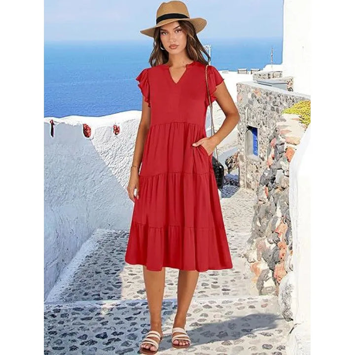 Elegant V-neck tiered midi dress for women, featuring charming flutter sleeves. A versatile summer piece.