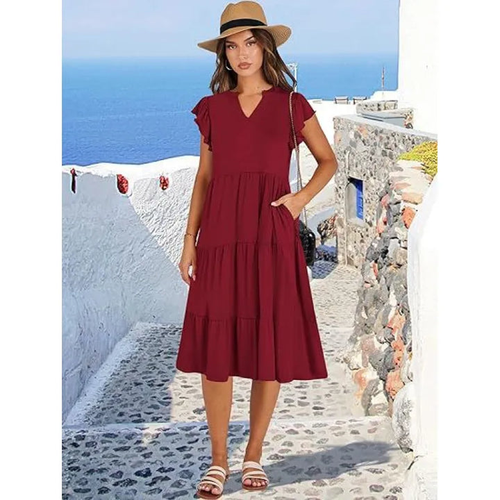 Women's V-neck tiered midi dress with flutter sleeves. Casual, comfortable, and chic for any season.