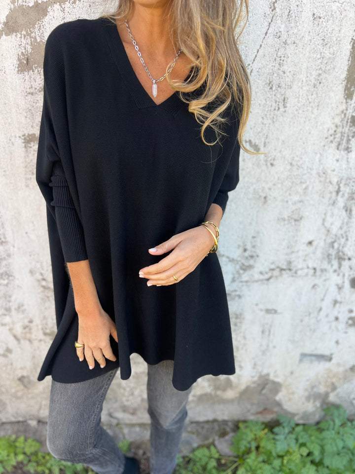 Women's v-neck tunic pullover jumper, comfortable relaxed fit for everyday casual wear.