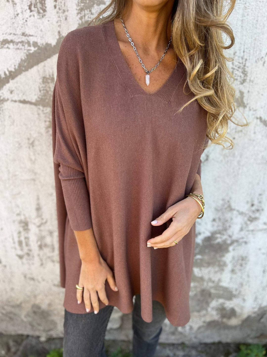 Effortless swing v-neck sweater for women, featuring a chic batwing sleeve design.