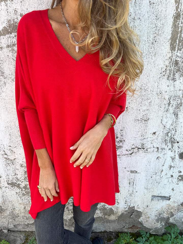 Stylish women's batwing sleeve v-neck sweater, comfortable and perfect for an oversized look.