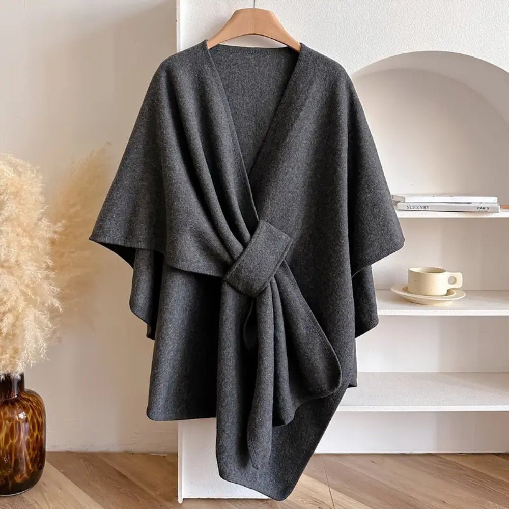 Chic women's all-season poncho scarf coat, offering a comfortable, versatile wrap style for elegant layering.
