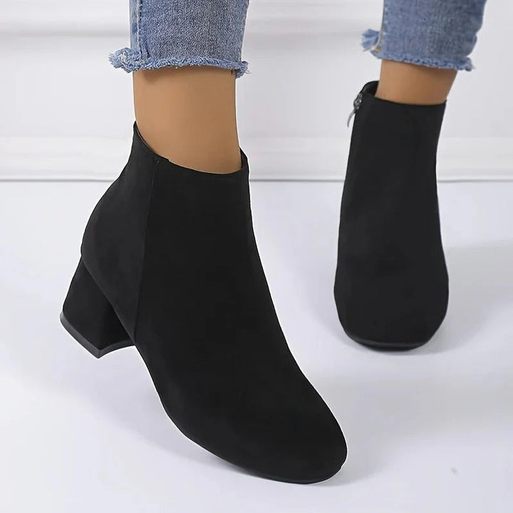 Trendy women's ankle boots with a stable block heel & side zip. Versatile design suits both casual and dressy looks.