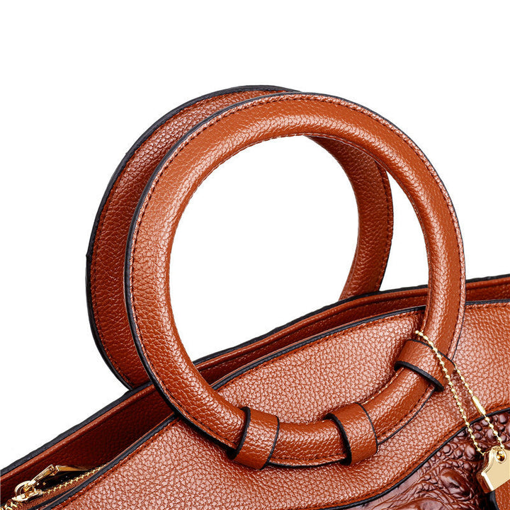 Stylish women's croc embossed shoulder bag, a versatile faux leather accessory.