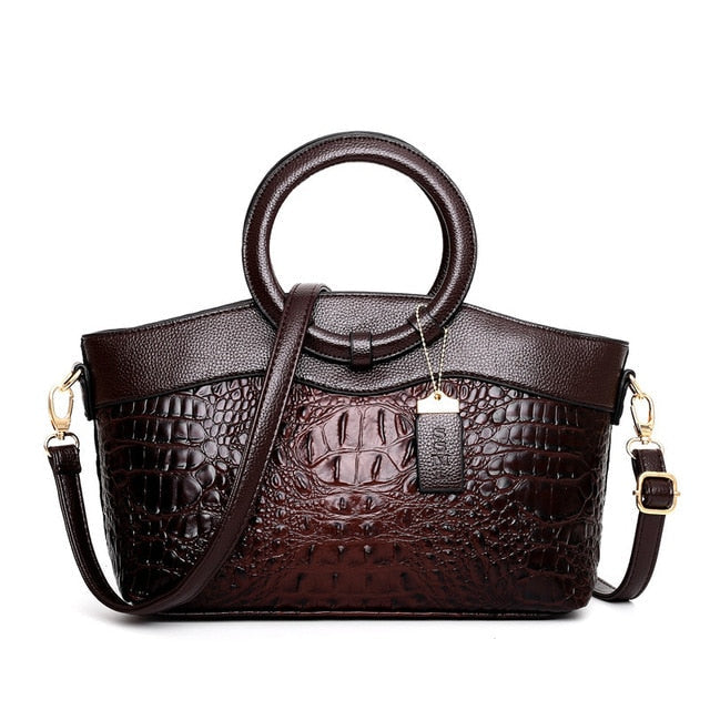 Modern women's versatile croc embossed shoulder bag, stylish faux leather accessory.
