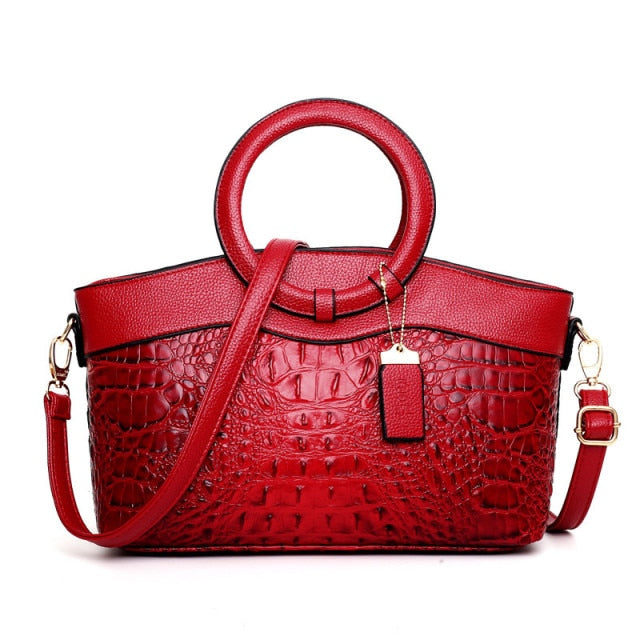 Chic women's versatile croc embossed faux leather handbag, perfect for work or play.