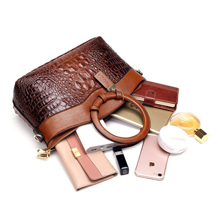 Chic women's versatile faux leather croc embossed handbag for modern outfits.