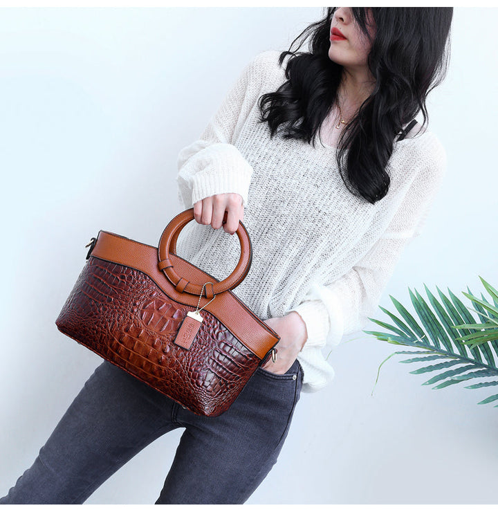 Versatile women's croc embossed faux leather handbag, perfect for any occasion.