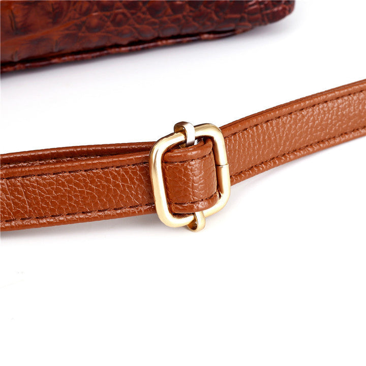 Women's vintage-inspired croc embossed shoulder bag, a stylish faux leather accessory.