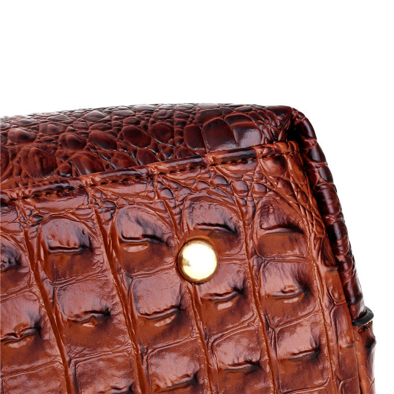 Elegant women's versatile faux leather croc embossed handbag, timeless appeal.
