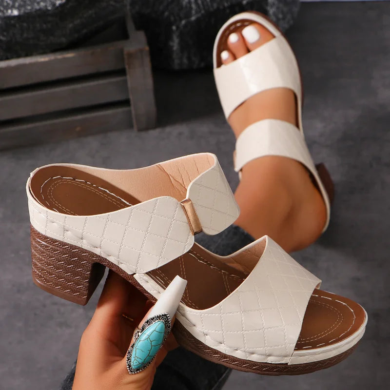 Fashionable women's heeled sandals. Comfortable slip-on leather design with block heels for summer style.