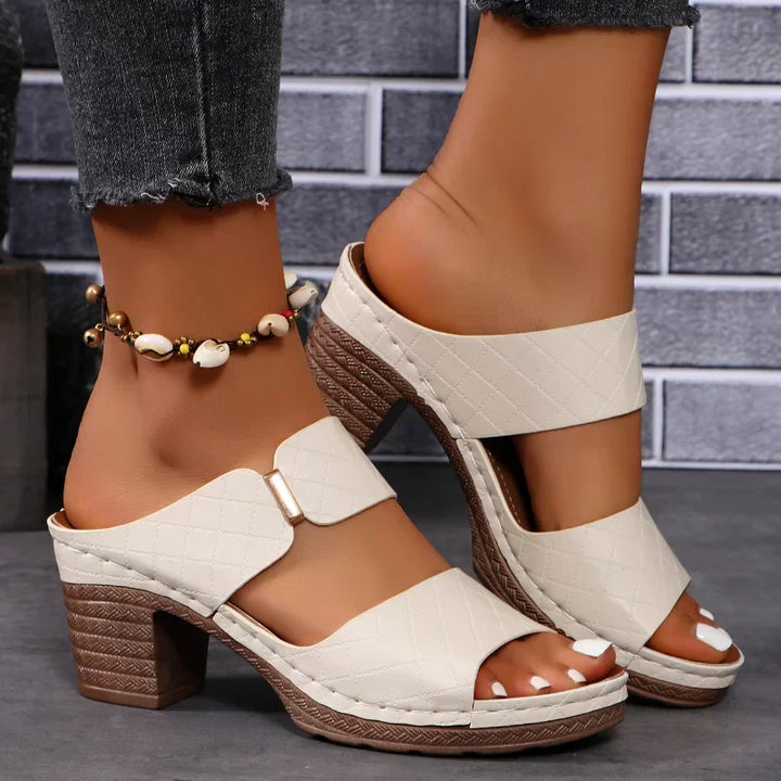 Comfortable women's block heel leather sandals. Easy slip-on design for elegant, all-day summer fashion.