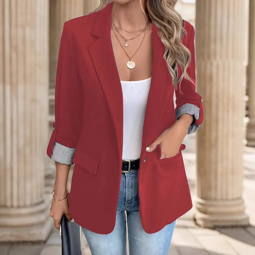 Elegant women's roll sleeve blazer with notch lapel and distinctive striped cuffs. Great for business casual.