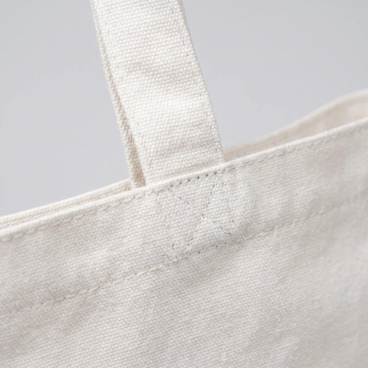 Foldable & reusable women's printed tote bag, perfect for shopping, beach, or daily errands.