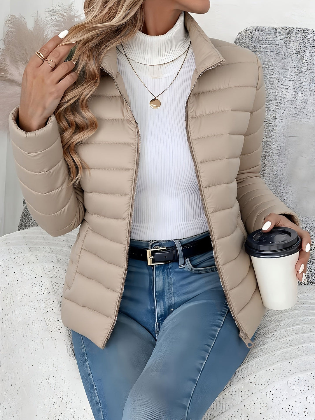 Everyday wear women's quilted jacket with a comfortable stand collar and practical zip closure. Great for fall/winter.