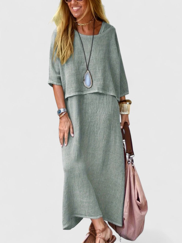 Stylish women's two-piece set: Short sleeve top paired with a comfortable, flowing maxi dress. Layered style.
