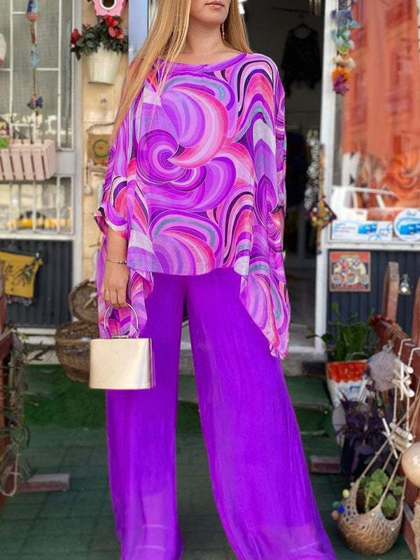 Women's elegant abstract print loungewear set with a relaxed batwing top & wide leg pants.