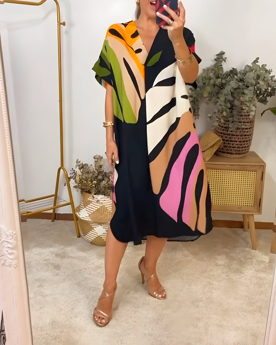Casual women's vibrant abstract print V-neck shift dress, perfect for summer or spring everyday wear.