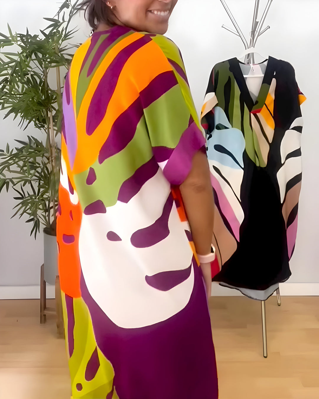 Women's artistic abstract print V-neck shift dress, comfortable & vibrant for everyday spring casual.