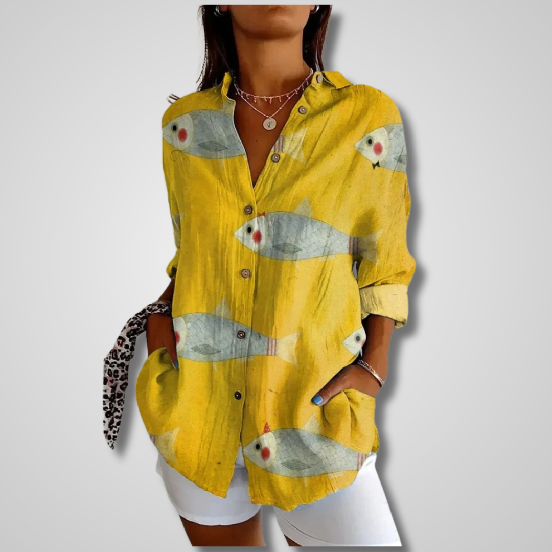 Fashionable women's artistic print blouse, a bohemian button-up with a v-neck, long sleeves, and oversized fit.