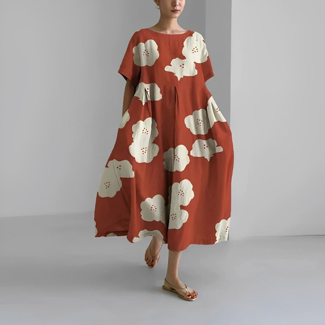 Women's vibrant floral maxi dress, flowing fabric captures movement, ideal for stylish summer resort wear.