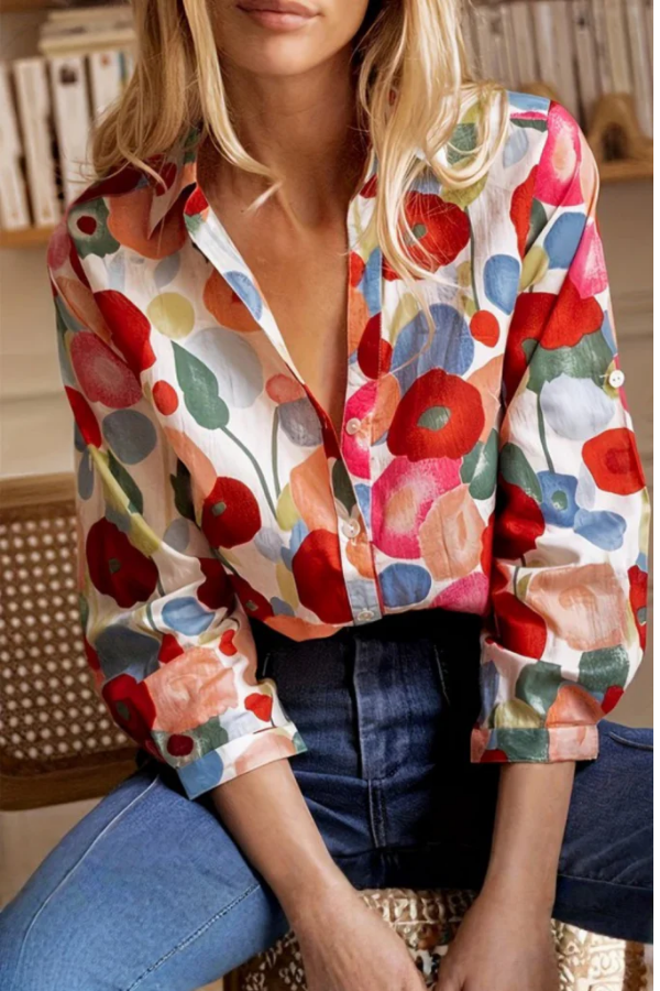Women's vibrant floral print button-down blouse with long sleeves, perfect for casual spring fashion or office wear.