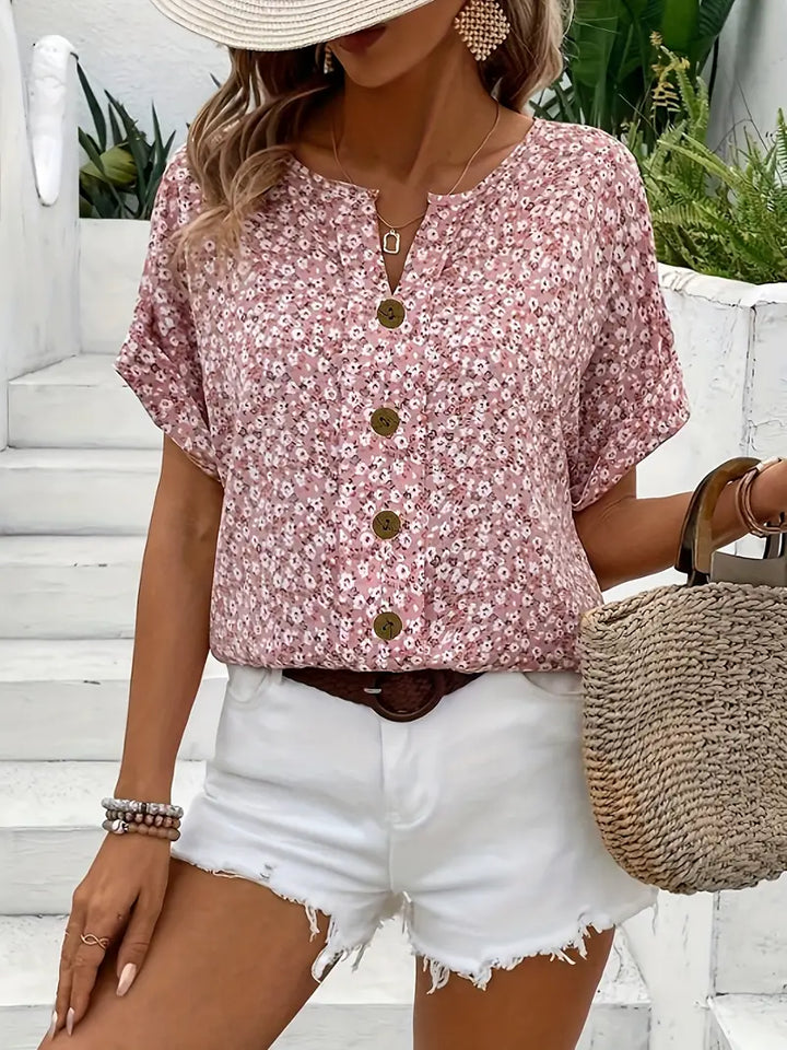 Women's vibrant floral print button-up blouse. Relaxed fit, long sleeve, perfect for spring casual or office wear.