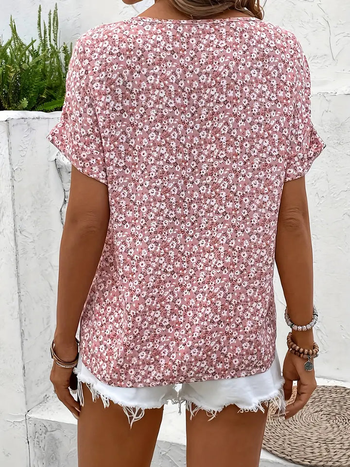 Elegant women's pink floral long sleeve button-up blouse. Relaxed, vibrant, suitable for office or casual spring style.