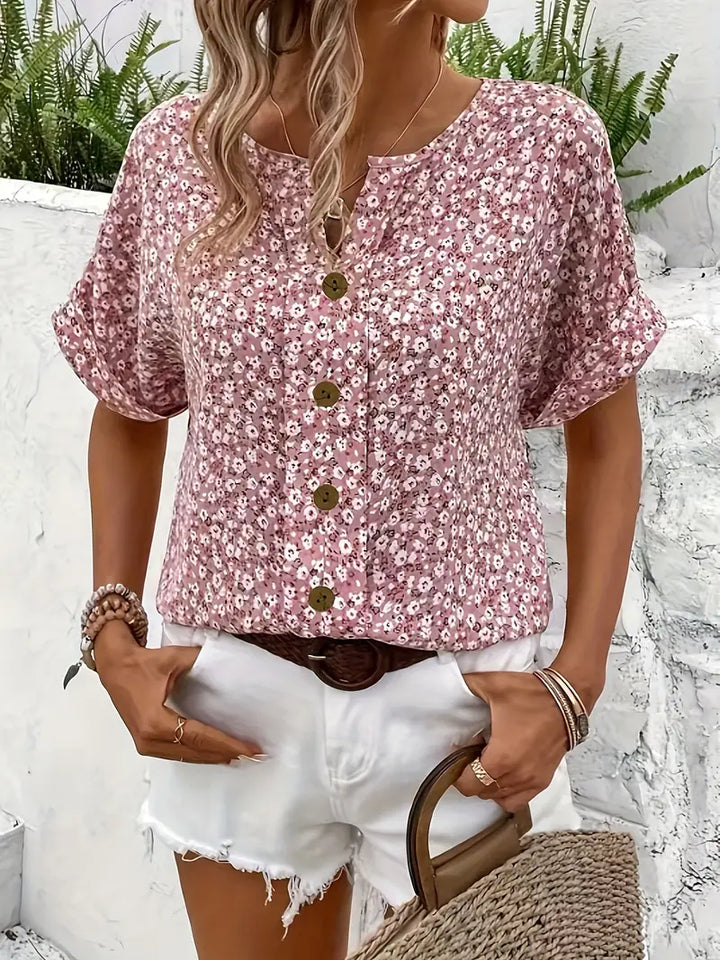 Vibrant floral women's button-up blouse with relaxed fit & long sleeves. Ideal elegant spring fashion or office top.