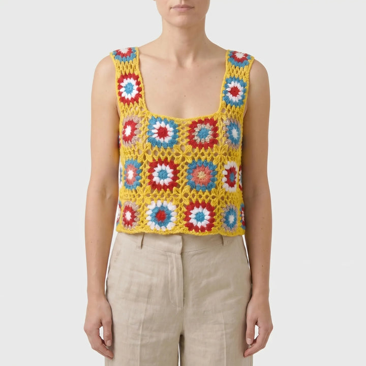 Lightweight women's sleeveless crop top with a vibrant floral print. Essential summer beachwear & casual top.