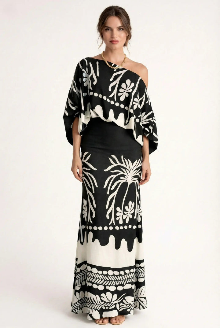 Comfortable women's summer outfit: a chic printed blouse paired with a breezy maxi skirt set for casual wear.