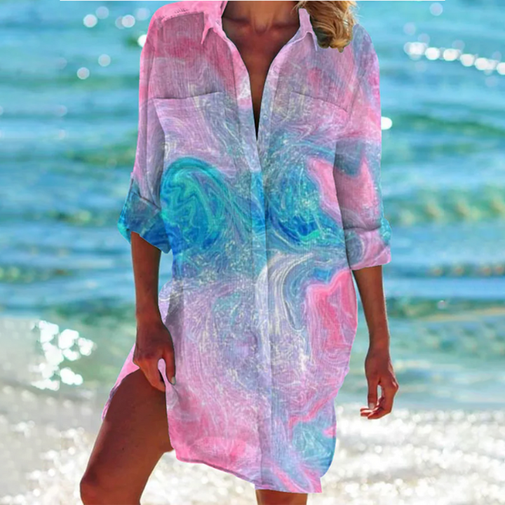 Women's casual printed summer top, loose fit, with pockets. Features vibrant patterns, great for resort & vacation.