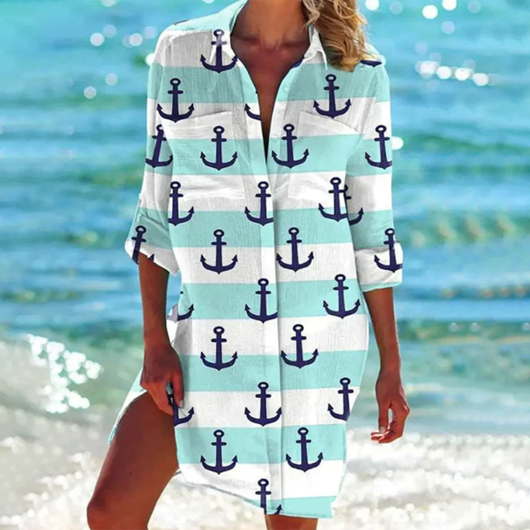 Vibrant printed women's summer shirt, relaxed fit, with pockets. Comfortable beachwear & stylish vacation top.
