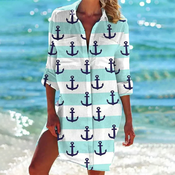 Vibrant printed women's summer shirt, relaxed fit, with pockets. Comfortable beachwear & stylish vacation top.