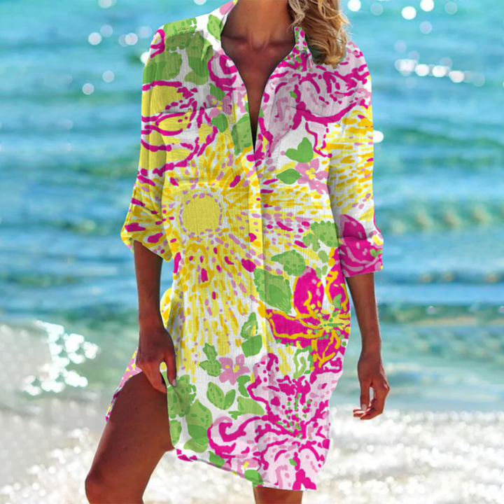 Oversized women's summer shirt with a vibrant print & pockets. Stylish loose fit top for vacation & casual wear.