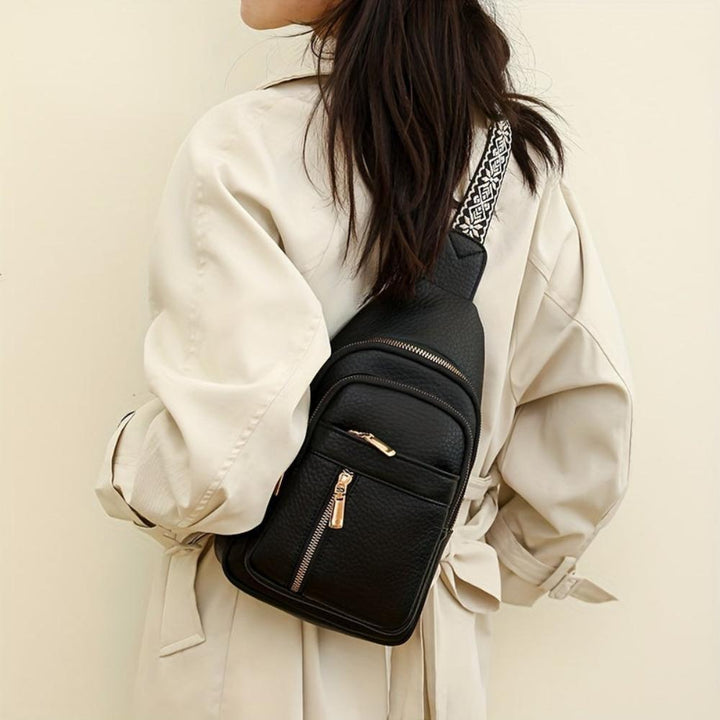 Vintage-inspired black leather crossbody, women's chest bag combining style and function.