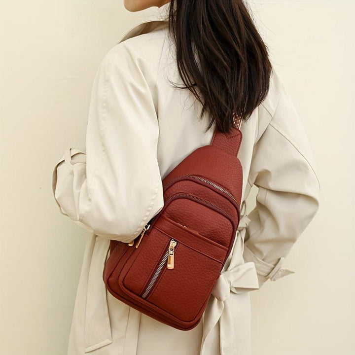 Retro red women's leather shoulder bag, an essential vintage crossbody chest bag.