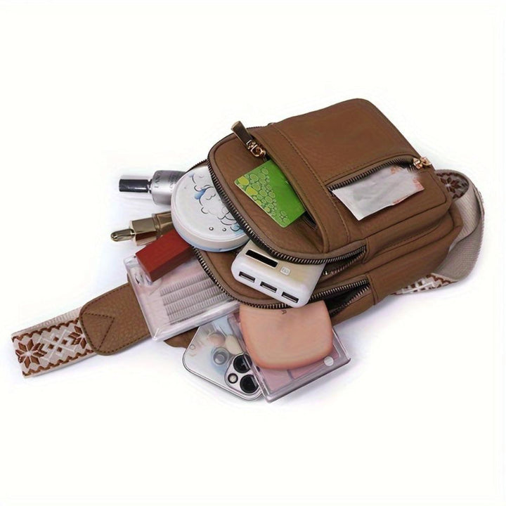 Women's black vintage leather crossbody, fashionable chest bag for modern retro style.