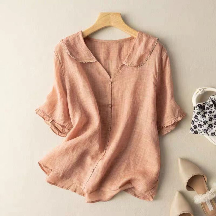 Chic women's vintage style blouse, button front with unique scalloped collar. Versatile for casual or office fashion.