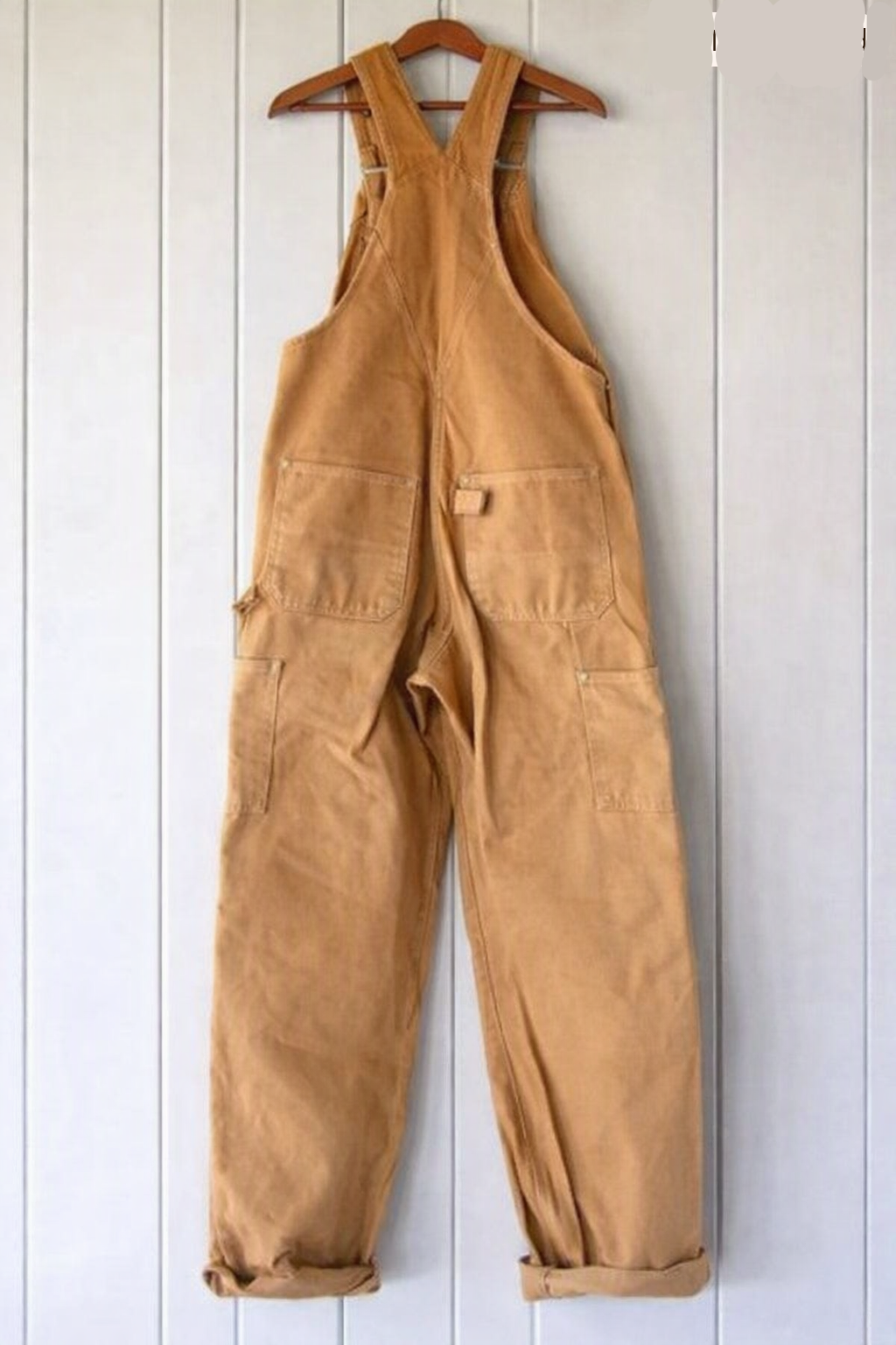Classic women's vintage bib overalls with a relaxed fit, useful pockets, and adjustable shoulder straps for comfort.