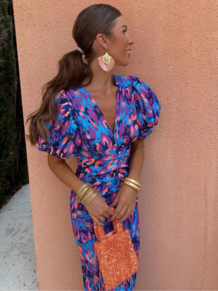 Eye-catching women's vivid midi dress with elegant ruching & a stunning abstract print for statement style.
