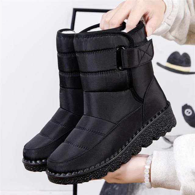 Plush padded women's winter boots, waterproof and warm, ensuring comfortable cold weather wear.